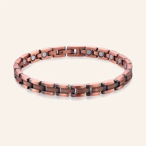 Bracelet de cheville en cuivre vieilli à maillons lisses et quadrillés, pastilles claires et fermoir à clip Bracelet de cheville en cuivre vieilli à maillons lisses et quadrillés, pastilles claires et fermoir à clip
