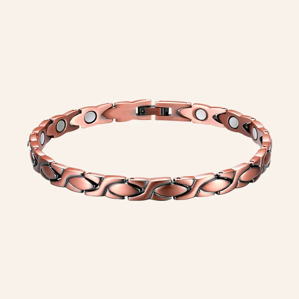 Bracelet de cheville en cuivre rosé, maillons en X croisés, pastilles rondes claires et fermoir à clip Bracelet de cheville en cuivre rosé, maillons en X croisés, pastilles rondes claires et fermoir à clip