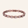 Chaîne de cheville en cuivre rosé à pierres rondes transparentes, pastilles métalliques et fermoir à clip Chaîne de cheville en cuivre rosé à pierres rondes transparentes, pastilles métalliques et fermoir à clip