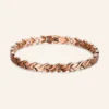 Bracelet en cuivre rosé à maillons feuilles croisées, pastilles rondes claires et fermoir à clip