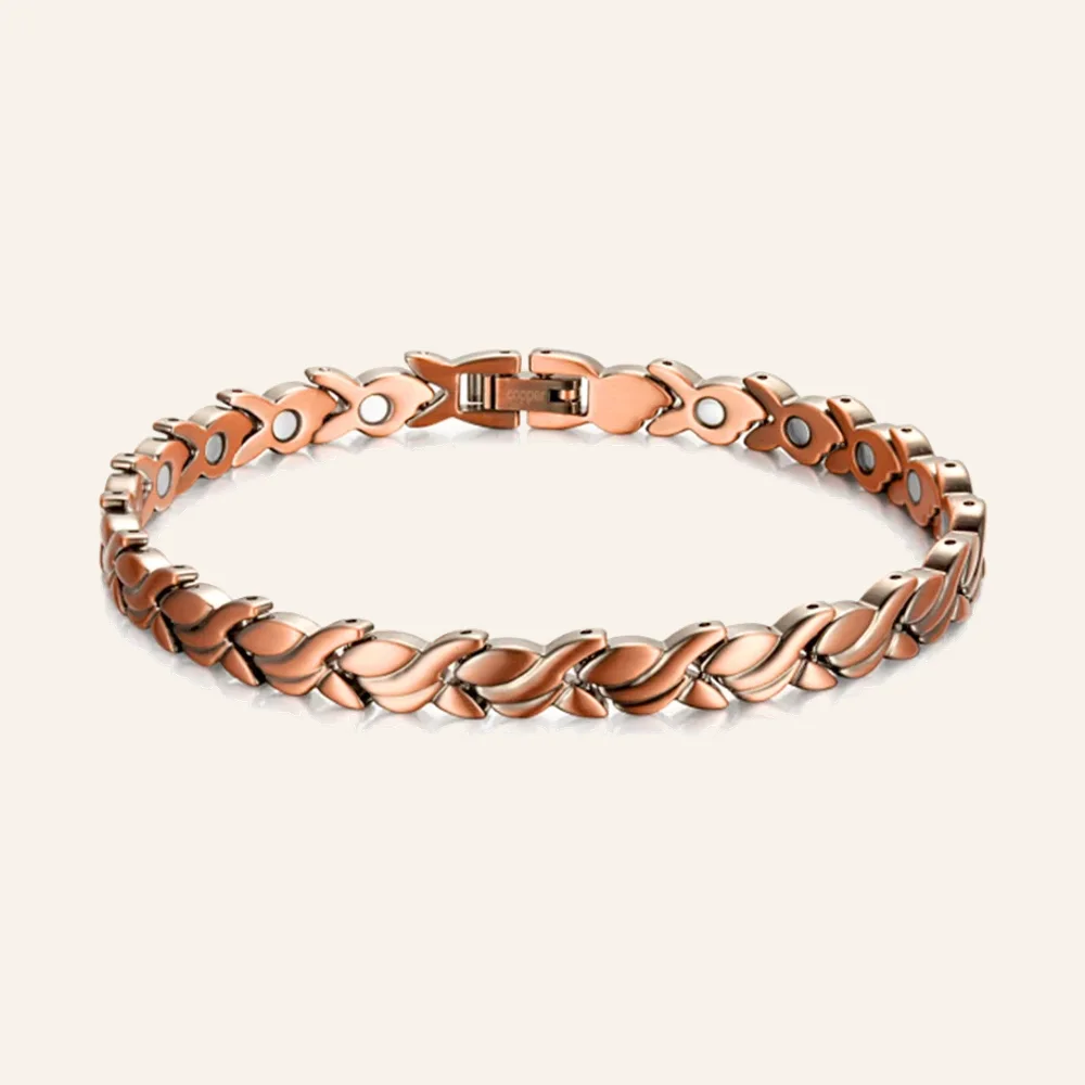 Bracelet en cuivre rosé à maillons feuilles croisées, pastilles rondes claires et fermoir à clip