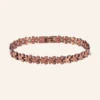 Bracelet articulé en cuivre rosé, maillons quadrilobés et pastilles claires, fermoir à clip Bracelet articulé en cuivre rosé, maillons quadrilobés et pastilles claires, fermoir à clip