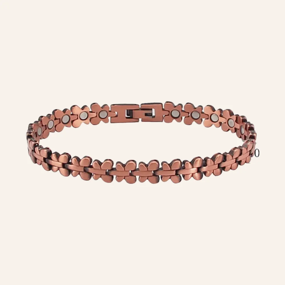 Bracelet articulé en cuivre rosé, maillons quadrilobés et pastilles claires, fermoir à clip Bracelet articulé en cuivre rosé, maillons quadrilobés et pastilles claires, fermoir à clip
