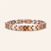 Bracelet à maillons rectangulaires en cuivre mat rosé, pastilles rondes claires et fermoir à clip