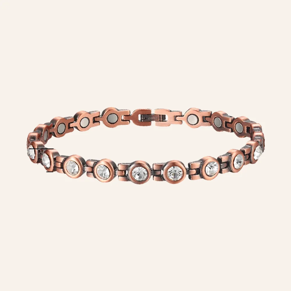Bracelet en cuivre patiné à maillons sertis de pierres rondes transparentes, fermoir à clip